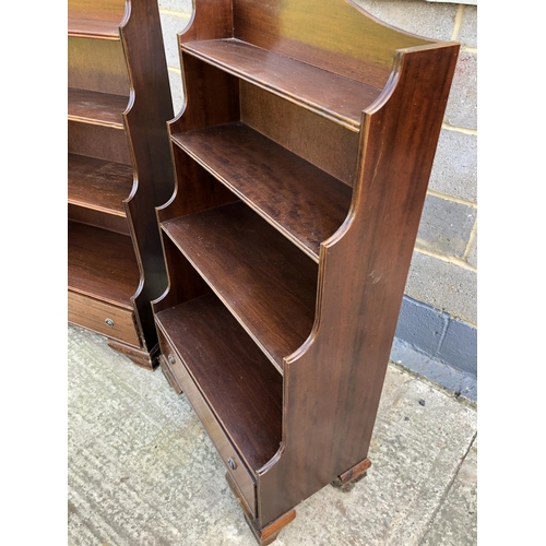 113 - A pair of reproduction Mahogany open front waterfall bookcases, each with a single drawer 76w 133h