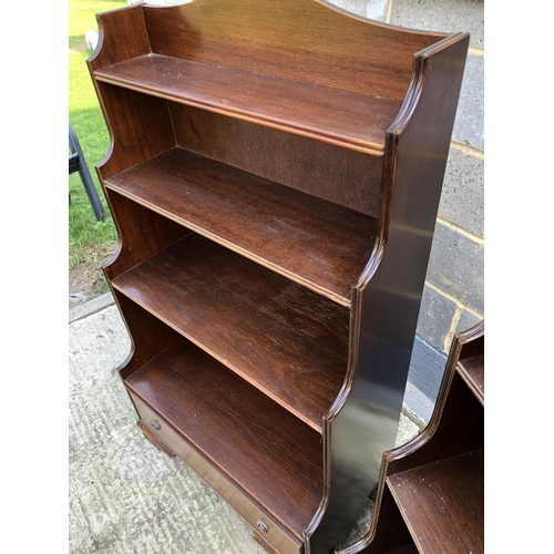 113 - A pair of reproduction Mahogany open front waterfall bookcases, each with a single drawer 76w 133h