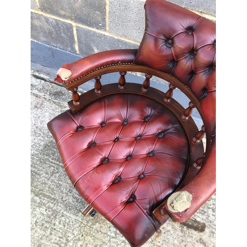 117 - A red leather Chesterfield Captains chair