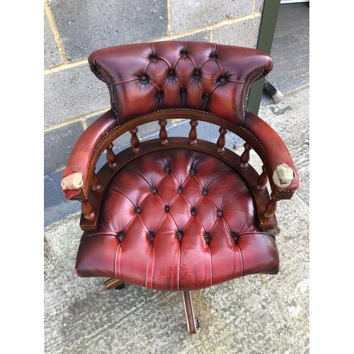 117 - A red leather Chesterfield Captains chair