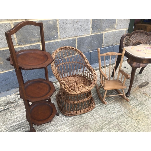 120 - A floral stool, together with two dolls chairs and a folding cake stand