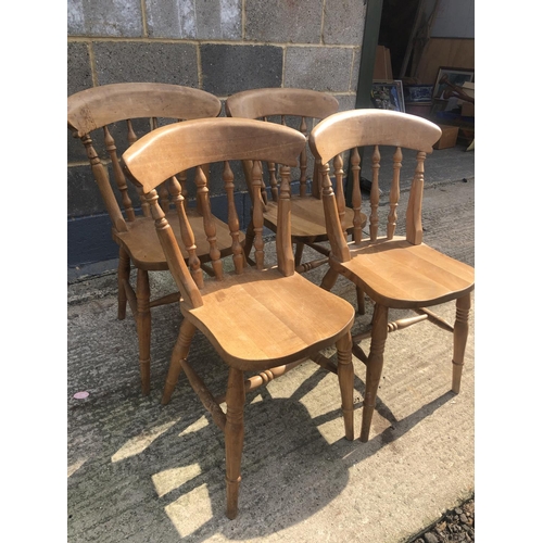 123 - A set of four pine Windsor chairs