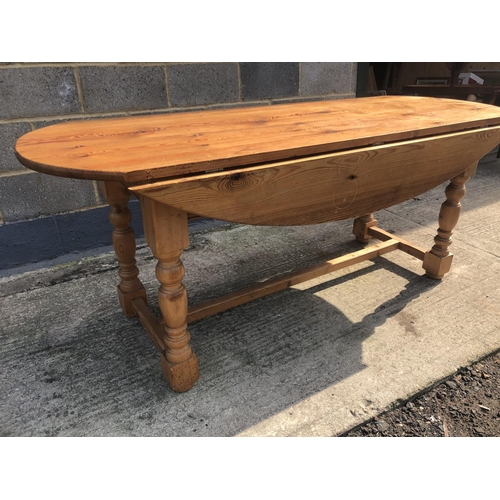 124 - A large pine drop leaf farmhouse dining table 198x70