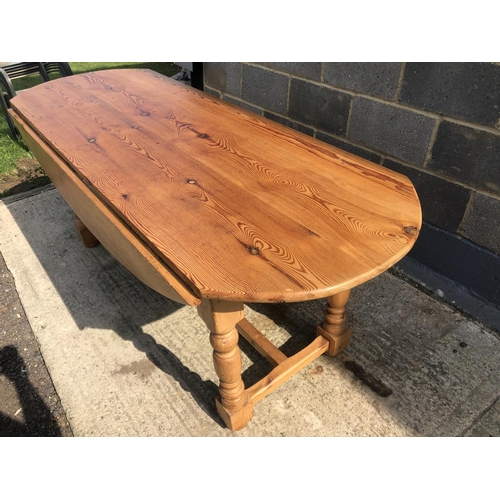 124 - A large pine drop leaf farmhouse dining table 198x70