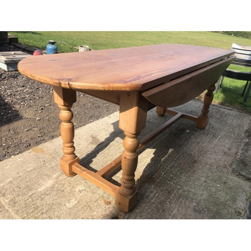 124 - A large pine drop leaf farmhouse dining table 198x70