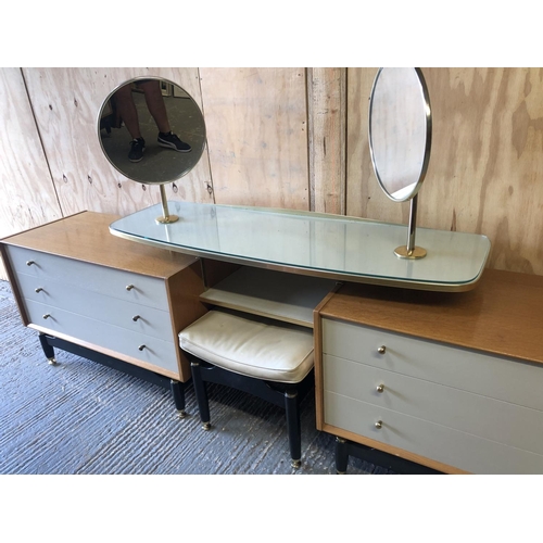 140 - A g Plan dressing chest unit designed by E Gomme. Two light oak chests of three connected by a float... 