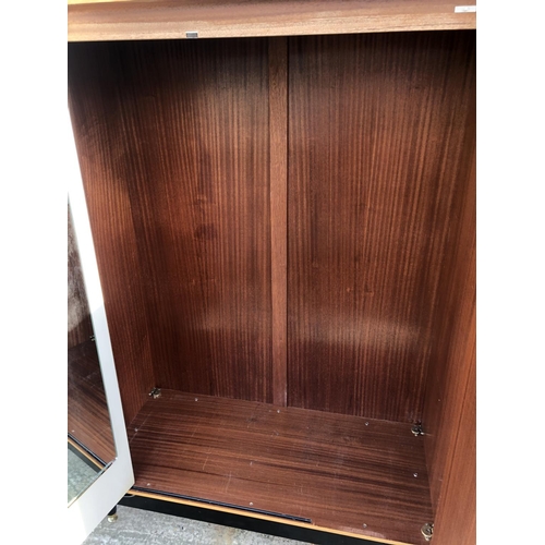 141 - A g Plan light oak triple wardrobe designed by E Gomme