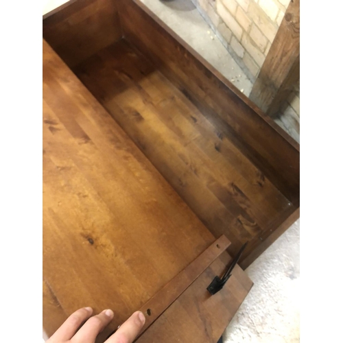 154 - A modern hardwood multi drawer coffee table with a lift up top