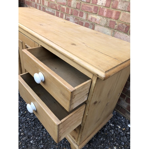 16 - Country pine sideboard, housing six drawers and a single cupboard door 154x49x80