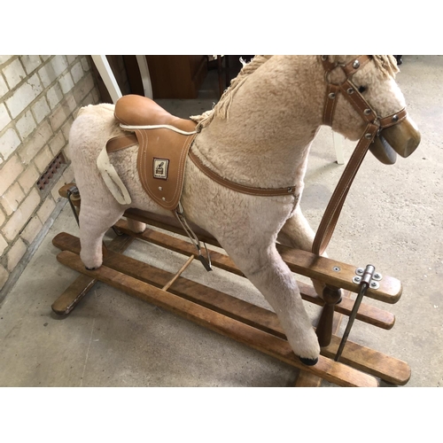 166 - A mamas and papas swing rocking horse