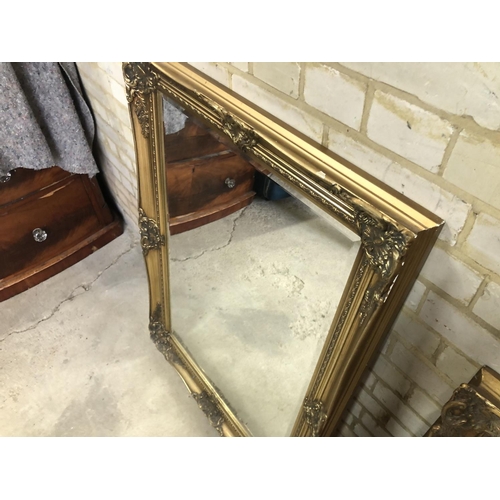 168 - A large gold gilt framed mirror together with one other