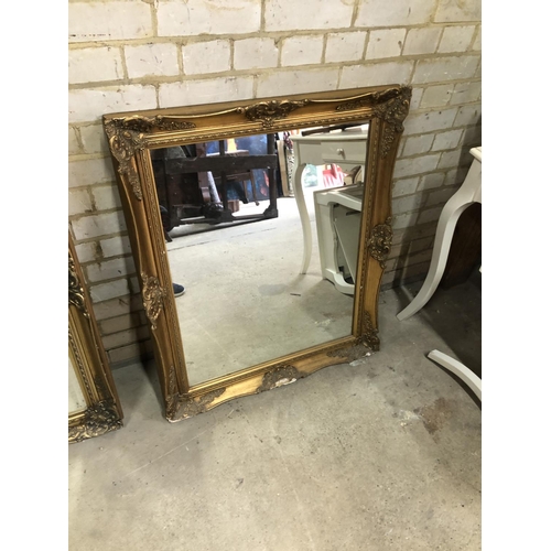 168 - A large gold gilt framed mirror together with one other