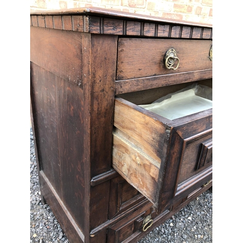 17 - A continental early oak chest of four drawers 104x57x98