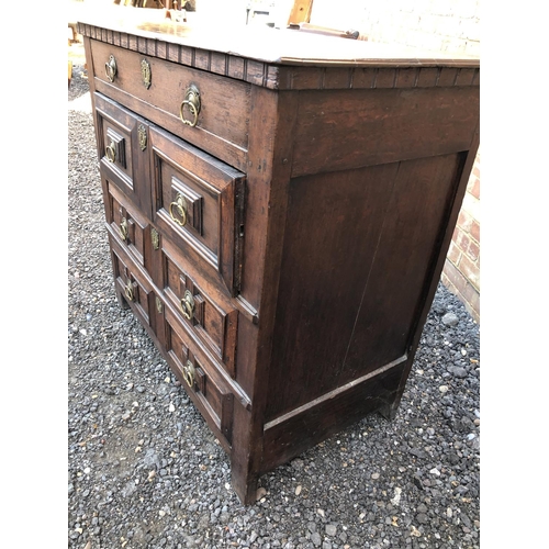 17 - A continental early oak chest of four drawers 104x57x98