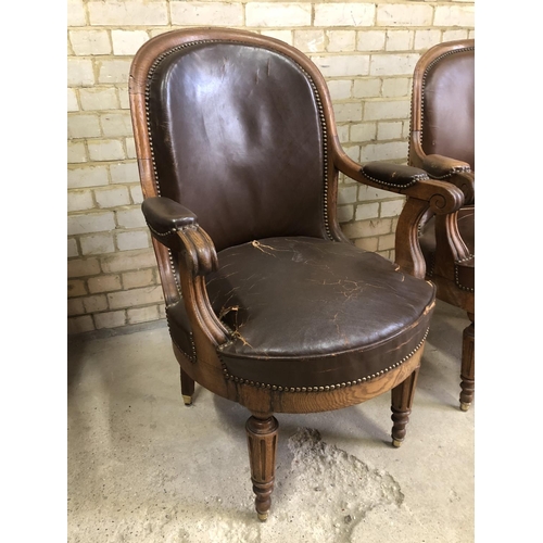 171 - A pair of Victorian oak framed library chairs with brass studs