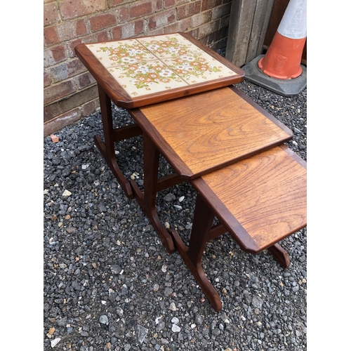 181 - A mid century teak nest of three tables