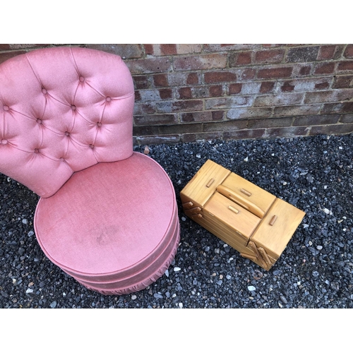 182 - A pink bedroom chair together with a sewing box