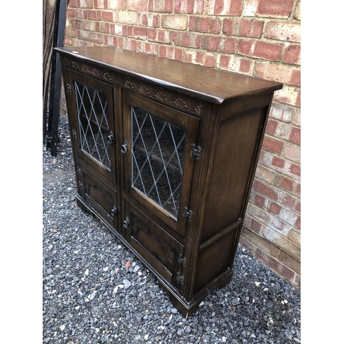 198 - An old charm oak leaded cabinet