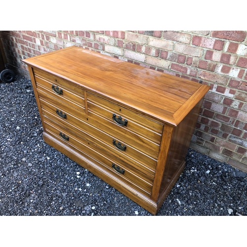 20 - A large Edwardian satinwood chest of four drawers 127x50x83