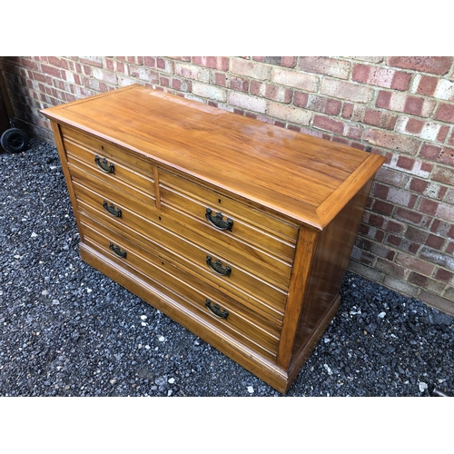 20 - A large Edwardian satinwood chest of four drawers 127x50x83