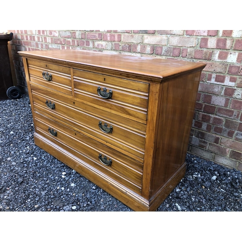 20 - A large Edwardian satinwood chest of four drawers 127x50x83