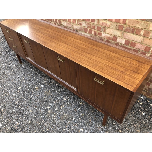 200 - A teak sideboard by g Plan with concertina doors and drinks cabinet section 221cm wide