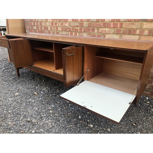 200 - A teak sideboard by g Plan with concertina doors and drinks cabinet section 221cm wide