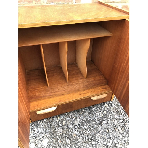 203 - A mid century teak record cabinet with a single drawer