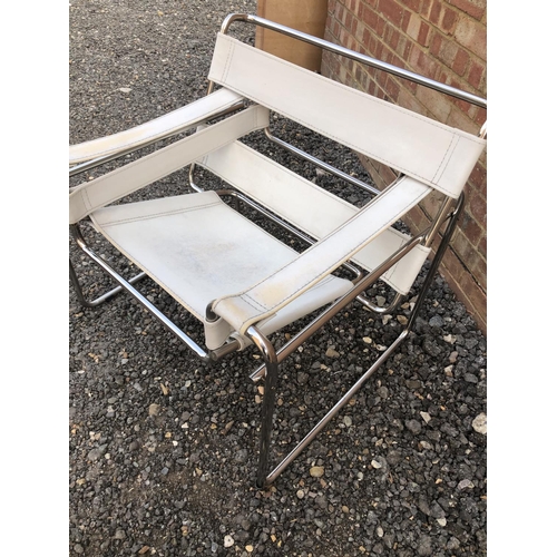 210 - A modernist design chrome chair with white vinyl seat