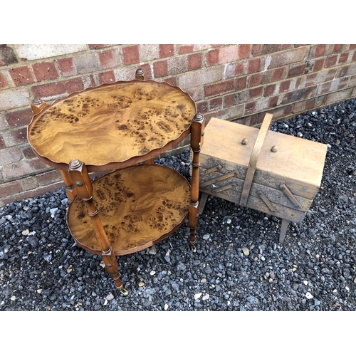 211 - A yew wood occasional table together with a concertina sewing box