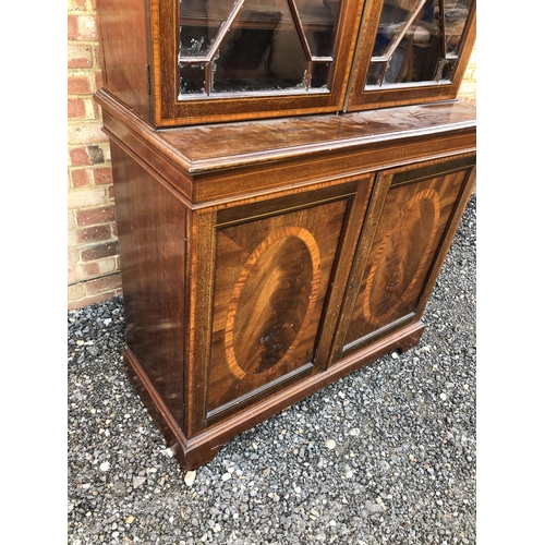 22 - An Edwardian mahogany bookcase cupboard with satinwood inlay 107x48x220