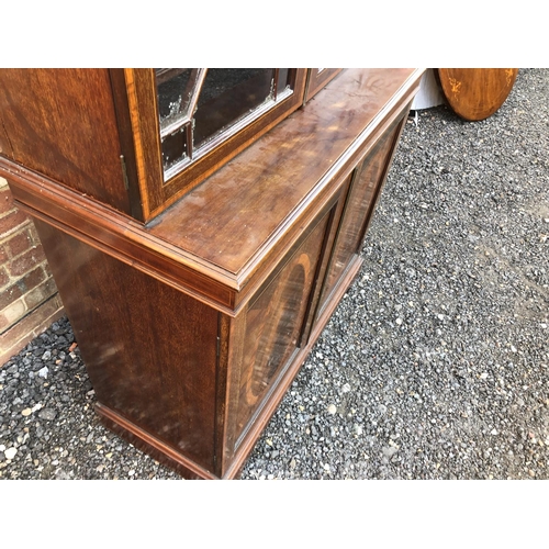 22 - An Edwardian mahogany bookcase cupboard with satinwood inlay 107x48x220