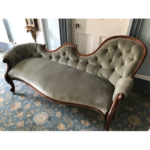 225 - A mahogany framed Victorian chaise lounge in green upholstery