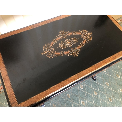 228 - A Victorian ebonised Card table with walnut inlaid sections, twisting and unfolding to reveal a blue... 