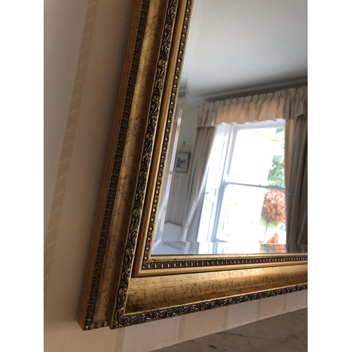 233 - A large gold gilt framed overmantle mirror 123x100