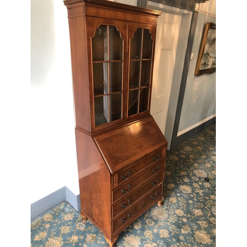 236 - A reproduction mahogany bureau bookcase with a fitted interior and writing slope 75x45x194