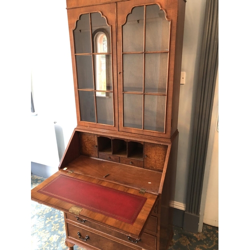 236 - A reproduction mahogany bureau bookcase with a fitted interior and writing slope 75x45x194