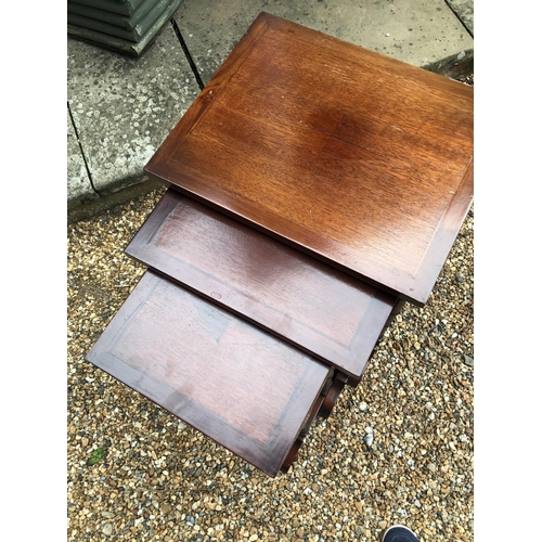 237 - A reproduction mahogany nest of three tables 44x35x73