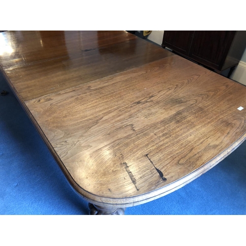 240 - A large Victorian oak wind out dining table with two extension leaves measures 276x142cm full extens... 