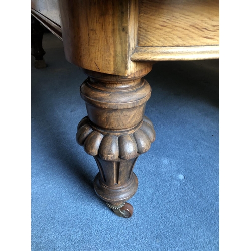 240 - A large Victorian oak wind out dining table with two extension leaves measures 276x142cm full extens... 