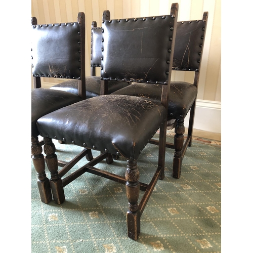 241 - A set of four oak chairs with brown leather upholstered seats