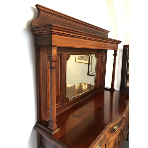 245 - An impressive large Edwardian mirror back sideboard housing three drawers over a three section cupba... 