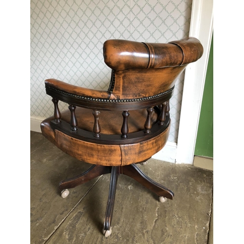 248 - A brown leather Chesterfield Captains desk chair