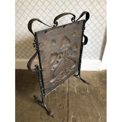 250 - Arts and crafts copper fire screen in iron surround (66x76)together with a matching copper fender