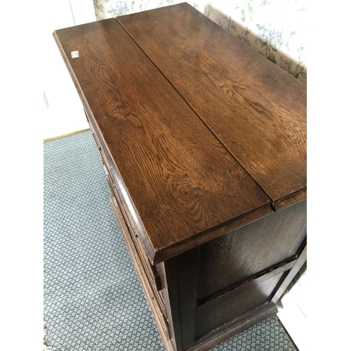 252 - A Jacobean style oak chest of five drawers with brass drop handles 91x50x105