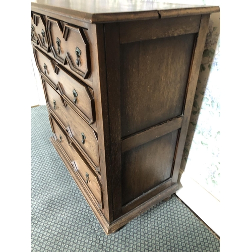 252 - A Jacobean style oak chest of five drawers with brass drop handles 91x50x105