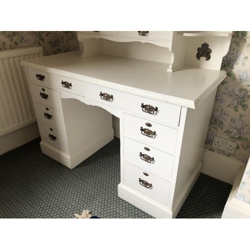 253 - A white painted kneehole dressing table with vanity mirror, two drawers and eight drawer base 121x54