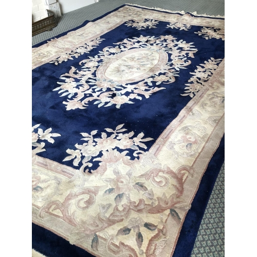 257 - A large blue patterned Chinese carpet 182x280