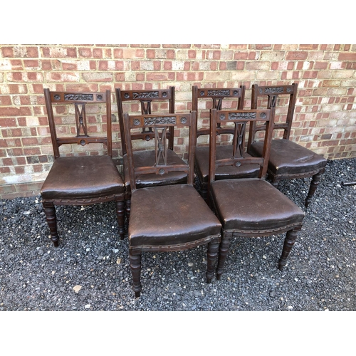 26 - A set of six Edwardian mahogany dining chairs with carved decoration