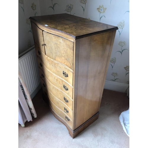 260 - A serpentine walnut gentlemans tallboy, cupboard top over five drawers 78x50x123